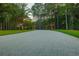 Long driveway leading to property, lined with trees and landscaping, and provides a grand entrance at 288 Tipperary Pl., Pawleys Island, SC 29585