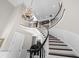 Elegant foyer showcasing a grand staircase, chandelier, and gleaming hardwood floors, all in a two-story space at 288 Tipperary Pl., Pawleys Island, SC 29585