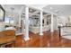Expansive living room with wood floors, columns, comfortable seating, and ocean view at 288 Tipperary Pl., Pawleys Island, SC 29585