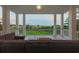Inviting porch with comfortable seating area overlooking a natural marsh landscape at 288 Tipperary Pl., Pawleys Island, SC 29585