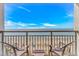 Balcony featuring two chairs, overlooking the beautiful beach and ocean views at 3000 N Ocean Blvd. # 1127, Myrtle Beach, SC 29577