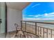 Balcony with chairs offers views of the beach, ocean, and blue skies at 3000 N Ocean Blvd. # 1127, Myrtle Beach, SC 29577