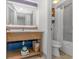 Bright bathroom featuring double sinks, ample counter space, and a shower with curtain at 3000 N Ocean Blvd. # 1127, Myrtle Beach, SC 29577