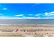 Expansive oceanfront view with colorful umbrellas dotting the sandy beach against a backdrop of clear blue skies at 3000 N Ocean Blvd. # 1127, Myrtle Beach, SC 29577