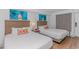 Inviting bedroom features two beds, contemporary decor, and soft, natural lighting at 3000 N Ocean Blvd. # 1127, Myrtle Beach, SC 29577