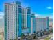 Modern oceanfront resort boasting sleek architecture, blue accents, and convenient parking at 3000 N Ocean Blvd. # 1127, Myrtle Beach, SC 29577