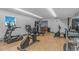 Well-equipped gym featuring treadmills, stationary bikes, and weight machines with wood-look floors at 3000 N Ocean Blvd. # 1127, Myrtle Beach, SC 29577