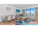 Inviting living room with comfortable seating, a dining table, and a sliding glass door to a balcony at 3000 N Ocean Blvd. # 1127, Myrtle Beach, SC 29577