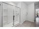 Modern bathroom with a glass enclosed shower and accessible grab bars at 305 Forestbrook Cove Circle, Myrtle Beach, SC 29588
