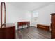 Well-lit bedroom featuring hardwood floors and three pieces of furniture at 305 Forestbrook Cove Circle, Myrtle Beach, SC 29588