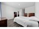 Well-lit bedroom with wood-look floors and ample storage space at 305 Forestbrook Cove Circle, Myrtle Beach, SC 29588