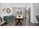 Bright dining room with wood floors, stylish decor, and a view to the backyard at 305 Forestbrook Cove Circle, Myrtle Beach, SC 29588