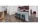 Kitchen with island and stool seating, granite countertops, stainless appliances, and dark wood cabinets at 305 Forestbrook Cove Circle, Myrtle Beach, SC 29588