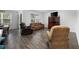 Comfortable living room with hardwood floors, ample seating, and bright natural light at 305 Forestbrook Cove Circle, Myrtle Beach, SC 29588