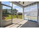 Relaxing screened porch with ceiling fan and view of pond and backyard at 305 Forestbrook Cove Circle, Myrtle Beach, SC 29588