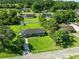 Aerial view of a beautiful home featuring a spacious yard, mature trees, and a serene neighborhood setting at 308 Sanders Ct., Mullins, SC 29574