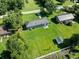 The backyard has ample green space, a storage shed, and a patio, ideal for relaxation and outdoor activities at 308 Sanders Ct., Mullins, SC 29574