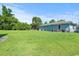 Large, grassy backyard offers plenty of space for outdoor activities and entertaining at 308 Sanders Ct., Mullins, SC 29574