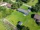 Large backyard with a garden, storage shed, and patio perfect for outdoor entertaining and gardening at 308 Sanders Ct., Mullins, SC 29574