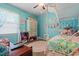 Stylish bedroom with light blue walls, a ceiling fan, and a unique canopy bed at 308 Sanders Ct., Mullins, SC 29574