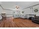 Spacious living room with hardwood floors, a ceiling fan, and comfortable seating at 308 Sanders Ct., Mullins, SC 29574