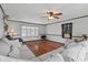 Cozy living room with wood flooring, ceiling fan, and comfortable seating at 308 Sanders Ct., Mullins, SC 29574