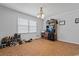 Comfortable living room with tile flooring, and a large window bringing in light for relaxing or entertaining at 308 Sanders Ct., Mullins, SC 29574