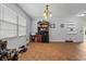 Inviting living room features tile flooring, neutral walls, large window for ample natural light, and ceiling fan at 308 Sanders Ct., Mullins, SC 29574