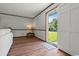 Inviting living room with hardwood floors and a sliding glass door at 308 Sanders Ct., Mullins, SC 29574