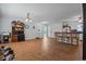 Spacious living room featuring tile floors, neutral walls, ceiling fan, and breakfast bar with chairs and kitchen views at 308 Sanders Ct., Mullins, SC 29574