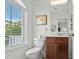 Half bath featuring a window with blinds and a vanity with storage at 310 Lockerbie Ct. # 1057, Myrtle Beach, SC 29577