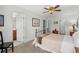 Bright bedroom with a ceiling fan and bathroom; showcasing a peaceful and inviting space at 310 Lockerbie Ct. # 1057, Myrtle Beach, SC 29577