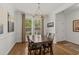Elegant dining room with hardwood floors, chandelier lighting, and large windows at 310 Lockerbie Ct. # 1057, Myrtle Beach, SC 29577