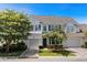 Charming two-story home with attached garages, beautiful trees, and lovely landscaping at 310 Lockerbie Ct. # 1057, Myrtle Beach, SC 29577