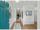 Bright entry hallway with hardwood floors and decorative rugs leading into the home at 310 Lockerbie Ct. # 1057, Myrtle Beach, SC 29577