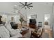 Spacious living room showcasing an open floor plan, hardwood floors, and a staircase leading to the second level at 310 Lockerbie Ct. # 1057, Myrtle Beach, SC 29577