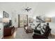 Well-lit living room with hardwood floors, cozy furniture, and large windows at 310 Lockerbie Ct. # 1057, Myrtle Beach, SC 29577
