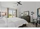 Comfortable main bedroom with a ceiling fan, large windows, and stylish decor at 310 Lockerbie Ct. # 1057, Myrtle Beach, SC 29577