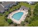Aerial view of community pool with lounge chairs and tables at 310 Lockerbie Ct. # 1057, Myrtle Beach, SC 29577