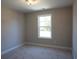 Cozy bedroom showcasing a window with natural light and neutral carpeting at 3137 Tiger Tail Rd., Conway, SC 29526