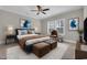 Well-appointed bedroom with blue accents, a large window, and modern decor at 3137 Tiger Tail Rd., Conway, SC 29526