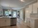 Open kitchen featuring stainless dishwasher, an island and a view to the living area at 3137 Tiger Tail Rd., Conway, SC 29526