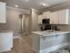 Kitchen with white cabinets, stainless appliances, and a breakfast bar at 3137 Tiger Tail Rd., Conway, SC 29526