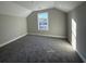 This bedroom is carpeted and has neutral paint and a window with natural light at 3139 Tiger Tail Rd., Conway, SC 29526