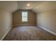 This bedroom is carpeted and has neutral paint and a window with natural light at 3139 Tiger Tail Rd., Conway, SC 29526