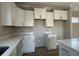 This kitchen features all white cabinets and a light countertop material at 3139 Tiger Tail Rd., Conway, SC 29526