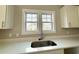 Bright kitchen sink and window view with white cabinets and countertop at 3139 Tiger Tail Rd., Conway, SC 29526