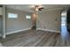 This open living room has a ceiling fan, stairs to the second floor and plank flooring at 3139 Tiger Tail Rd., Conway, SC 29526