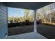 Covered patio overlooking a private backyard with views of mature trees and green space at 3139 Tiger Tail Rd., Conway, SC 29526