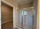 Modern shower with white subway tile, a glass door, and adjacent walk in closet for storage at 3139 Tiger Tail Rd., Conway, SC 29526